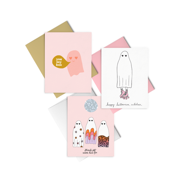 Halloween greeting cards in 3 variations; Halloween greeting card with pink ghost and word bubble saying "you my boo"; Greeting card with 3 ghosts in various designs under a disco ball saying "ghouls just want to have fun"; Greeting card with ghost in roller skates saying "happy halloween, witches"