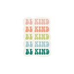 A sticker that has "Be Kind" printed multiple times in different colored lettering. "Be Kind" is stacked on top of each other 4 times.