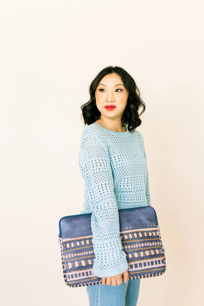 Girl in a blue sweater holding a cute laptop case in Boho Dress pattern.