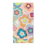 Trippy flower pattern beach towel with an array of colors.