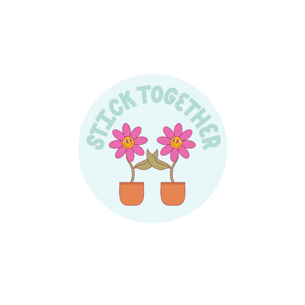 Circle sticker that says Stick Together with two pink flowers holding pedals.