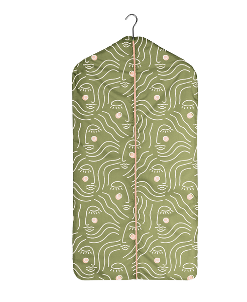 Adult Sized Olive Green Garment Bag a white outline silhouette drawing of a woman's face with blush colored cheeks. Peach Zipper