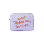 Medium waffle material pastel purple pouch with colorful "catch flights not feelings" text on it.
