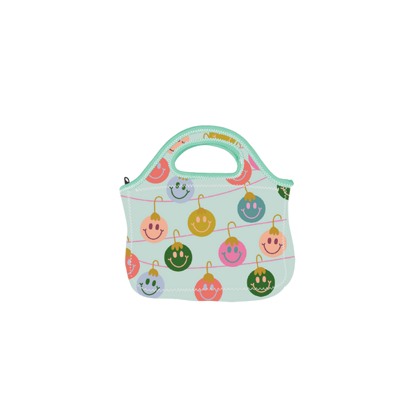 Klutch with handles in light blue; multi-color smiley ornaments design wrapped around bag.