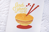 White greeting card with a bowl of noodles and chop sticks. The text says 