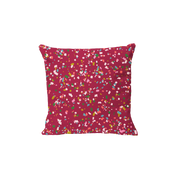 Red holiday pillow with confetti 