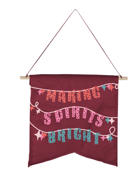 medium maroon banner with the phrase making spirits brights being sprung out in lights.