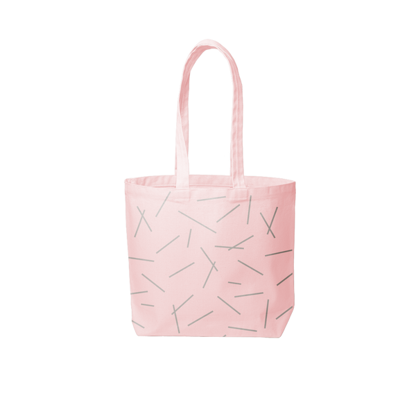 a pink canvas tote bag with pixie stick print