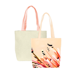 Two cute tote bags; one peach in paradise print and one natural straw with peach canvas straps.