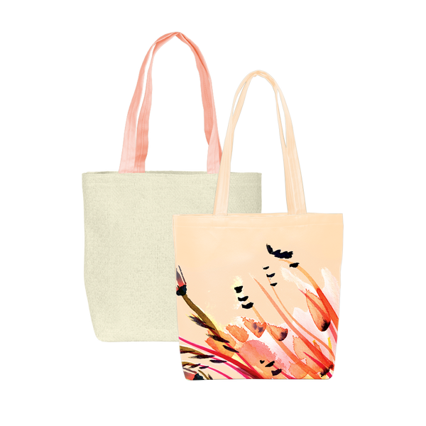 Two cute tote bags; one peach in paradise print and one natural straw with peach canvas straps.
