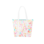 Cute tote bag in white with rainbow confetti print, white straps, and blue zippered top.