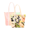 Two cute tote bags with zippered top; lush tropical print and pastel ombre print.