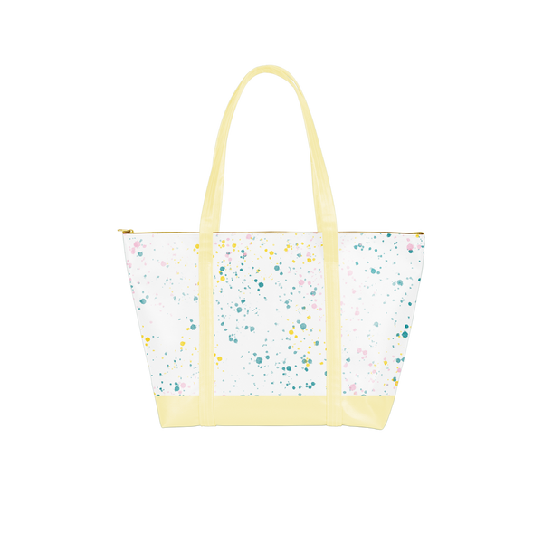 vegan leather weekend bag with white splatter and yellow handles