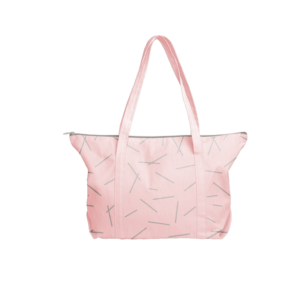 Cute travel bag in pink canvas with pixie sticks pattern and double shoulder straps.