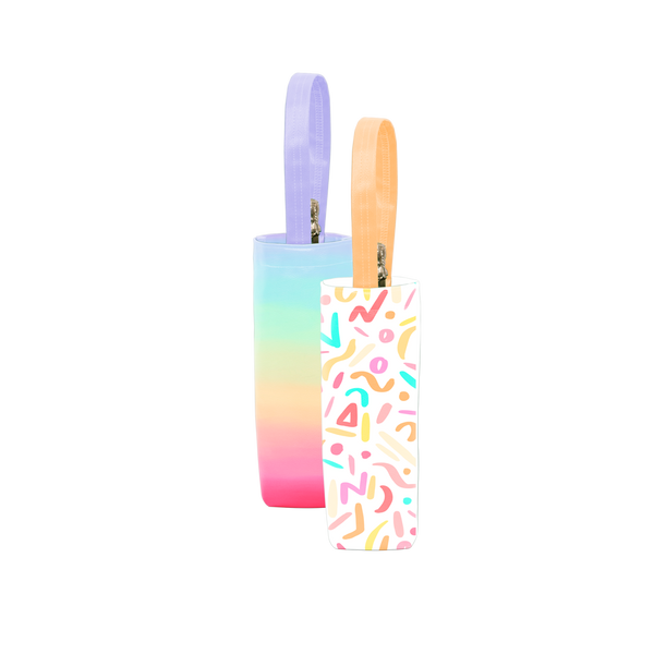 Two cute wine tote bags; one white with confetti print and yellow handles, the other rainbow ombre with a purple handle.