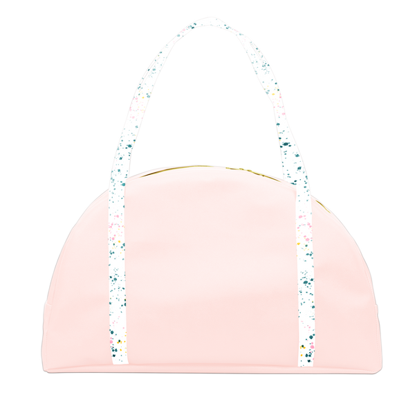 Travel tote bag in blush pint with white paint splatter print double shoulder straps.
