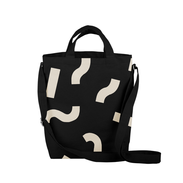 Cute tote bag in black canvas with adjustable shoulder strap and macaroni pattern.