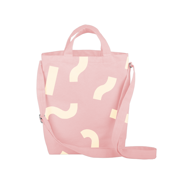 Cute tote bag in blush pink canvas with adjustable shoulder strap and macaroni pattern.