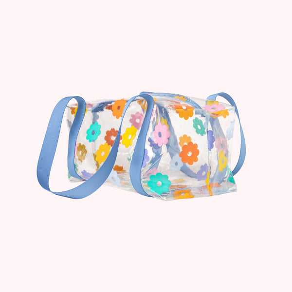 Clear daisy lil darling bag with periwinkle handles.