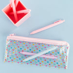 A clear Pixie pouch with multi-colored hears printed on and a light pink zipper. Blush Pink, Powder Blue, and Lilac Jotter pens included.