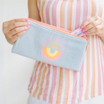 Cute cosmetics pouch in light denim with Daydreamers Club and a rainbow imprint -- Daydreamers