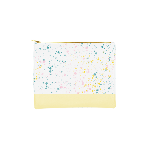 Large makeup pouch in white with paint splatter print and yellow trim along the bottom.