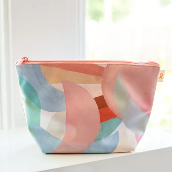 A medium sized pouch with overlapping moon phases printed on in different pastel colors. 