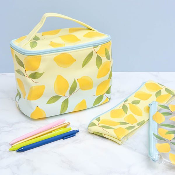 A Lemon Soulmate toiletries case, and cute pencil pouches lay next to three jotter pens.