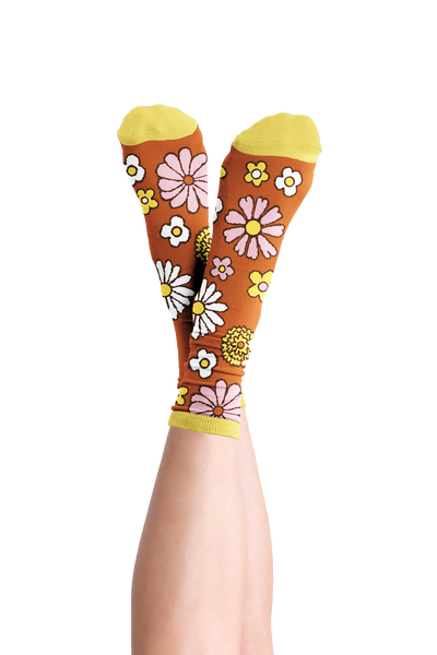 Crossed feet with Flower Power groovy retro socks