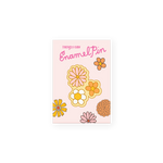 enamel pin of three daisy flowers in pink, white and orange
