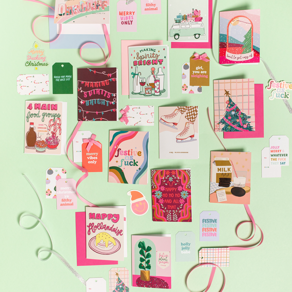 Layout of various holiday cards, gift tags and stickers