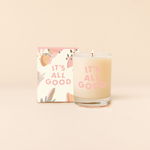 14 oz Rocks glass candle with text that reads "IT'S ALL GOOD" in pink font. Box packaging with same design sits behind candle.
