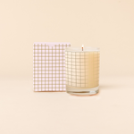 14 oz Rocks glass candle with gold grid pattern wraps around glass. Box packaging with same pattern sits behind candle.