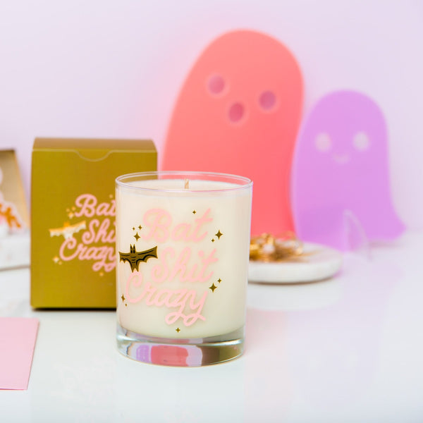 Bat Shit Crazy Rocks Glass Candle with pink acrylic ghosts 