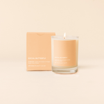 14 oz candle rocks glass with peach decal and text that reads "SOCIAL BUTTERFLY, smells like: single and ready to mingle, happy hour, floater, with notes of: peach + sea salt" in white font. Peach box packaging with same design sits behind candle.