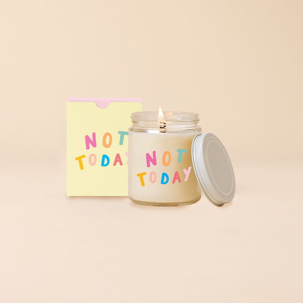 Glass jar candle reading "NOT TODAY" in multi-candle text. Box packaging with same text as candle. 
