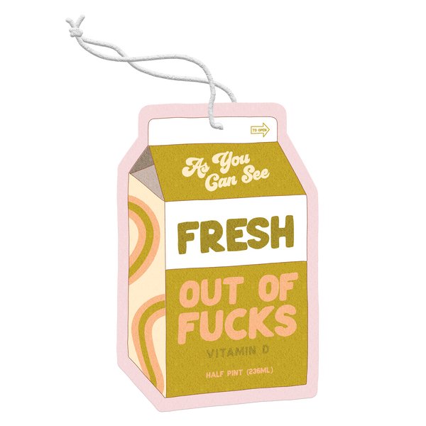 Air freshener shaped like a milk carton with "As you can see Fresh Out Of Fucks" in a groovy block print. 