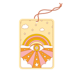 Tarot card air freshener with stars, clouds, a rainbow, and eye with a flower in it surrounded by groovy pink, yellow, and orange colors.