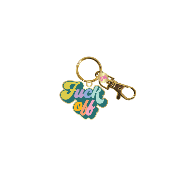 Gold key charm with teal background and "Fuck It" in rainbow letters.