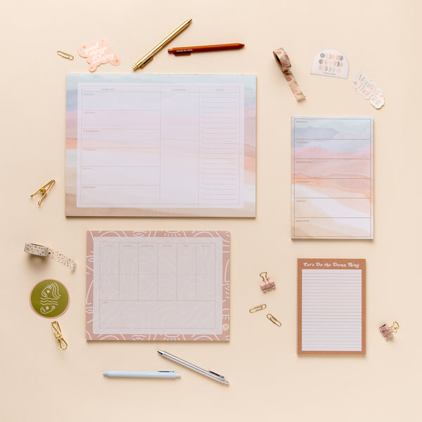 1 extra large weekly notepad; 1 large weekly notepad; 1 medium weekly desk pad and 1 small notepad. Includes 4 TOOT pens, 4 TOOT stickers, and 2 washi tapes. 