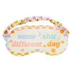 Rainbow checkered border sleep mask with "Same Shit Different Day' on it while it is surrounded with clouds, stars, a moon, and a sun.