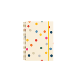A large spiral bound notebook with colorful polkadots on the cover.