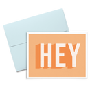 Hey Dots is an orange greeting card with bold graphic lettering and a blue envelope.