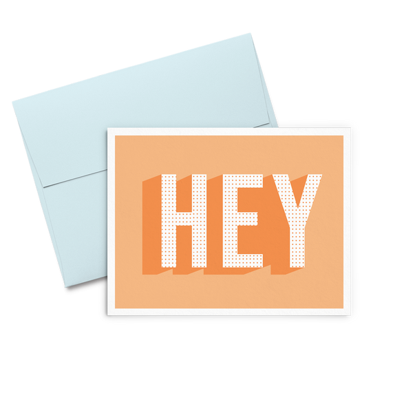 Hey Dots is an orange greeting card with bold graphic lettering and a blue envelope.