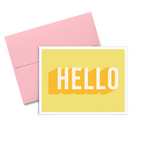 Hello Dots yellow greeting card with bold text and a pink envelope.