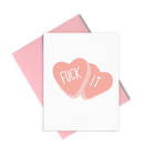 Fuck It is a greeting card of two red candy hearts and a pink envelope. 