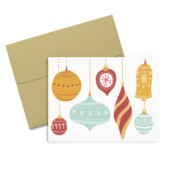 greeting card with different shaped ornaments in blue, orange and red with a white background. 