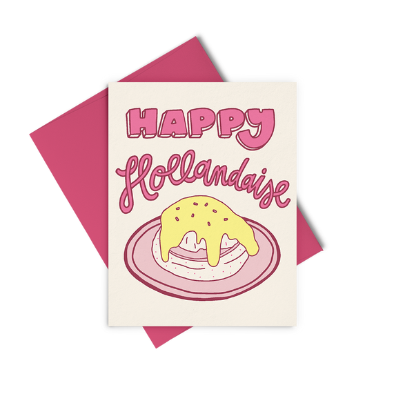 A white greeting card that says in pink "happy hollandaise" with yellow hollandaise sauce on a sandwich