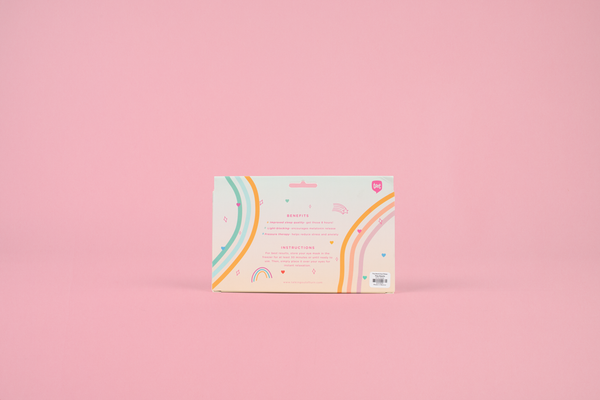 Back side of Lemon Sorbet Eye Pillow packaging. It is a pastel rainbow gradience with two multicolored rainbow arches.