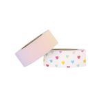 Two rolls of washi tape. The first with a rainbow ombre, and the second with rainbow mini hearts. 